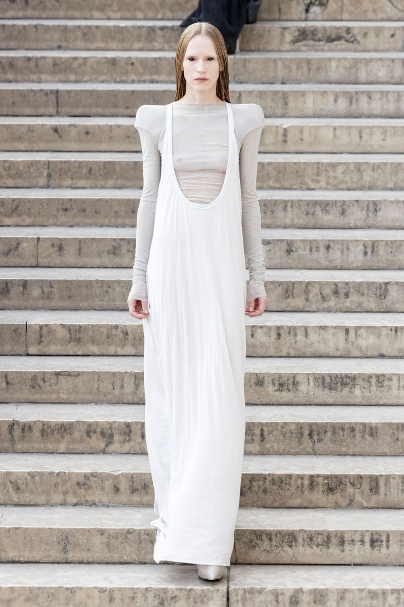 rick owens white dress Lilies IT FEATURES AN OPEN RIGHT SIDE BODY THAT SECURES WITH TIES ALL THE WAY DOWN TO THE HIP Rick Owens Ruched Asymmetric Gown