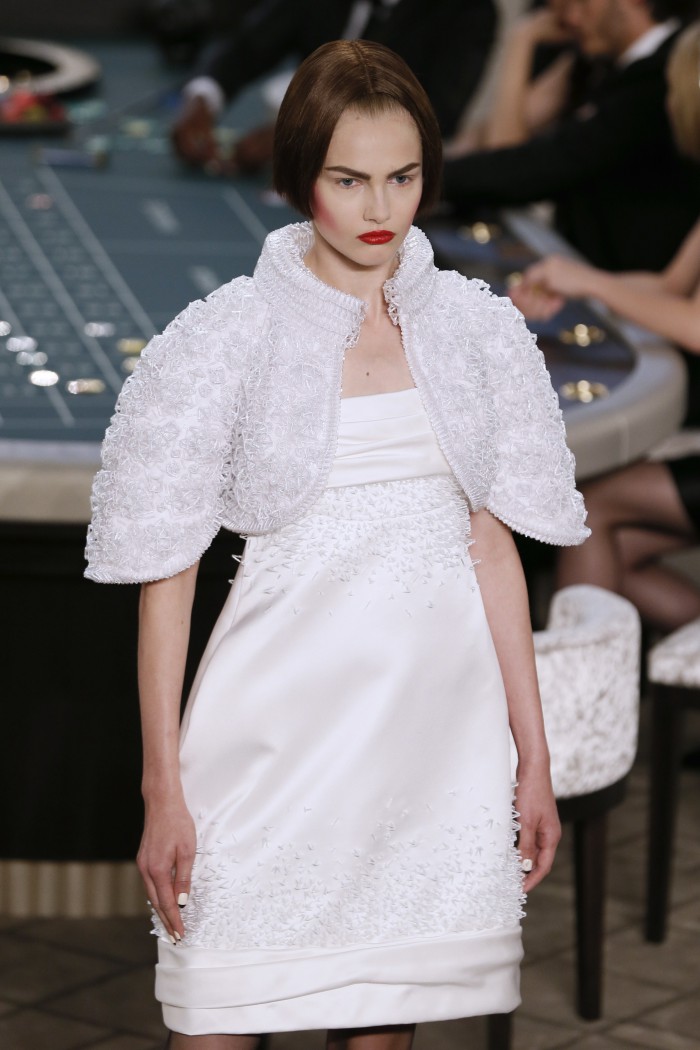 A model presents a creation for Chanel during the 2015-2016 fall/winter Haute Couture collection fashion show on July 7, 2015 at the Grand Palais in Paris.            AFP PHOTO / PATRICK KOVARIK        (Photo credit should read PATRICK KOVARIK/AFP/Getty Images)