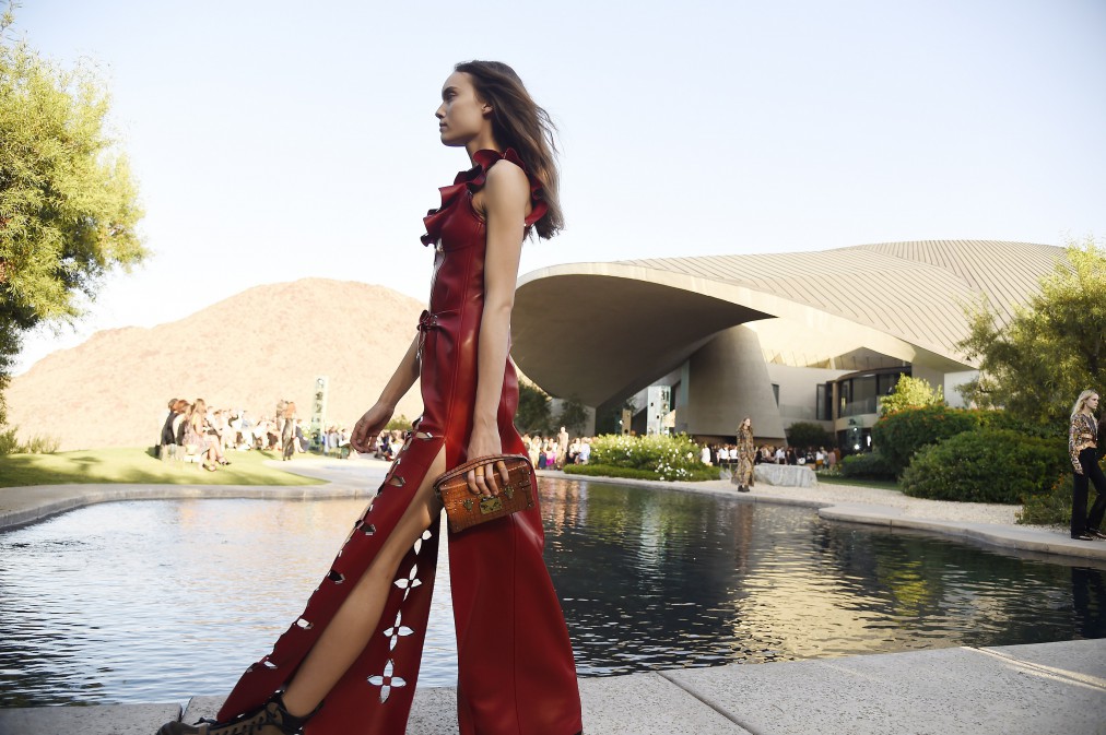 Models present creations from the Louis Vuitton 2016 cruise collection, designed by Nicolas Ghesquière, May 6, 2015, at the Bob and Dolores Hope Estate in Palm Springs, California. AFP PHOTO / ROBYN BECK (Photo credit should read ROBYN BECK/AFP/Getty Images)