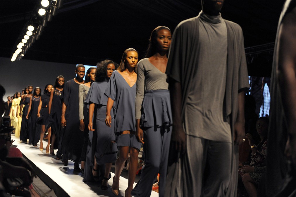 Models present creations designed by Sisiano during the Lagos Fashion and Design Week, on October 31, 2015. The yearly Lagos Fashion and Design Week (LFDW) is designed to promote the Nigerian and ultimately, the African fashion industry by bringing together buyers, consumers and the media to view the current collections of African designers in Lagos. AFP PHOTO / PIUS UTOMI EKPEI (Photo credit should read PIUS UTOMI EKPEI/AFP/Getty Images)